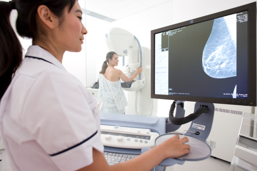 Radiologist reviewing results of patients mammogram